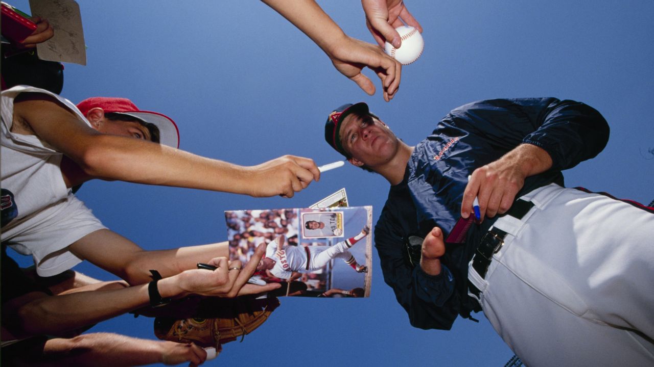 ANAHEIM, CA - 1989:  Jim Abbott of the California Angels signs autographs before a game in the 1989 season at Anaheim Stadium in Anaheim, California. (Photo by Scott Halleran/Getty Images)