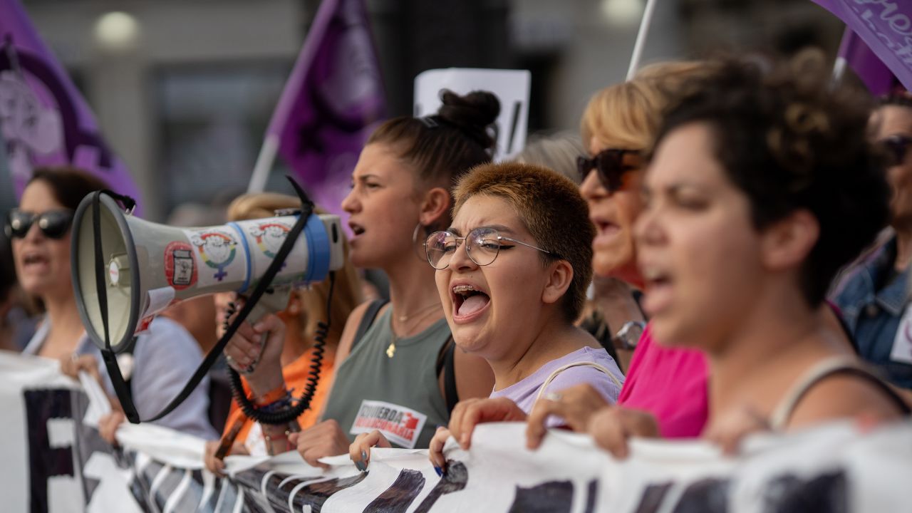 People are seen participating in a protest against Rubiales in Madrid, Spain, on Friday.