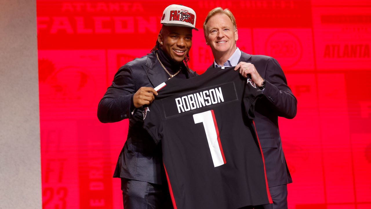 KANSAS CITY, MISSOURI - APRIL 27: (L-R) Bijan Robinson poses with NFL Commissioner Roger Goodell after being selected eight overall by the Atlanta Falcons during the first round of the 2023 NFL Draft at Union Station on April 27, 2023 in Kansas City, Missouri. (Photo by David Eulitt/Getty Images)