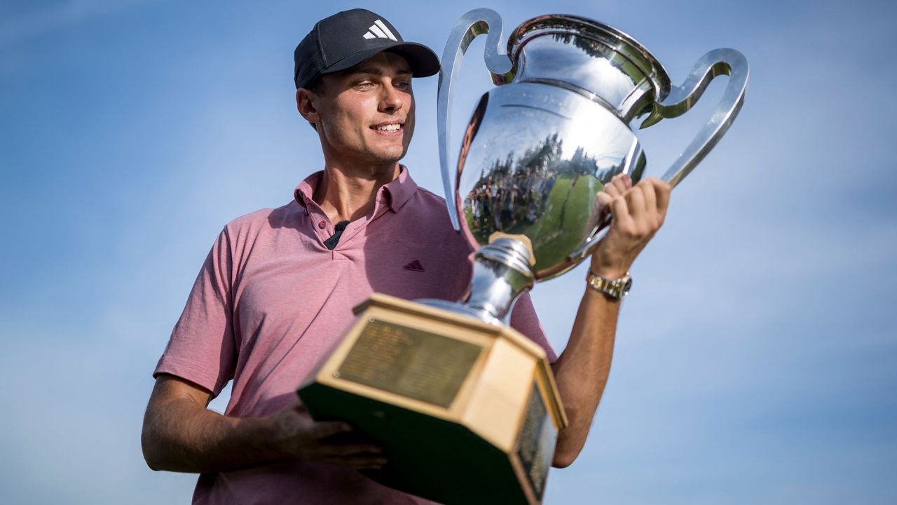 Sweden's Ludvig Aberg poses with the trophy after winning the European Tour's European Masters golf tournament in Crans Montana, western Switzerland on September 3, 2023. (Photo by Fabrice COFFRINI / AFP) (Photo by FABRICE COFFRINI/AFP via Getty Images)