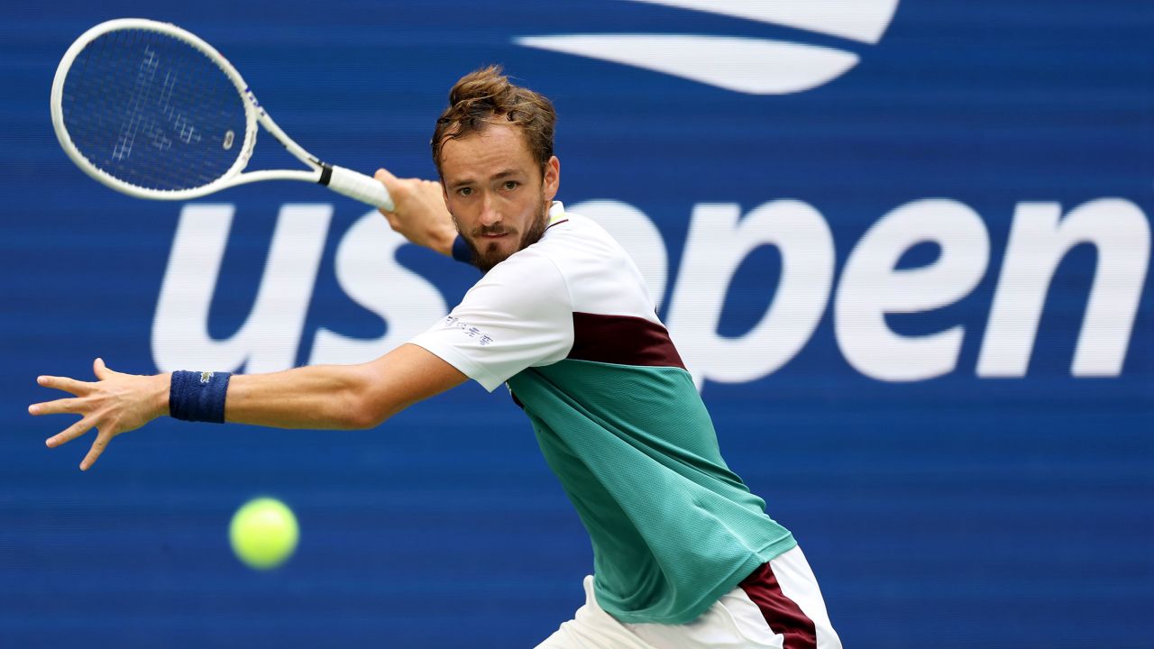 Medvedev returns a shot against Rublev.