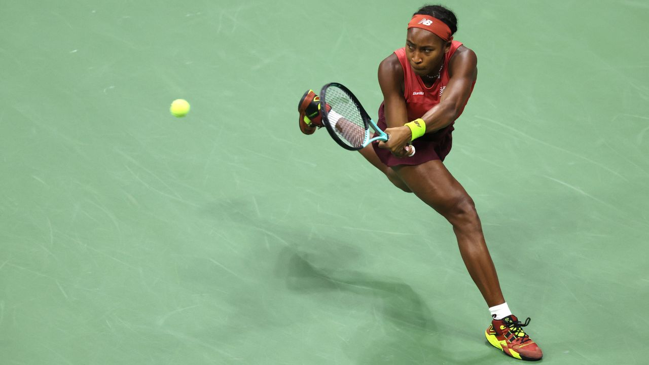 Coco Gauff returns a shot against Aryna Sabalenka.