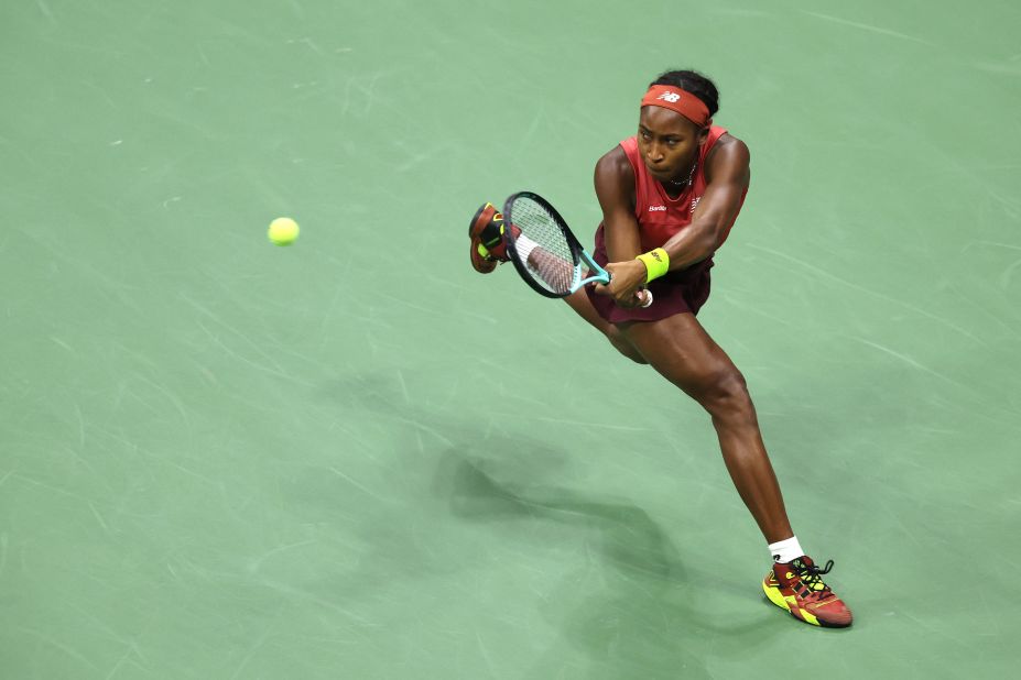 Gauff returns a shot against Sabalenka.