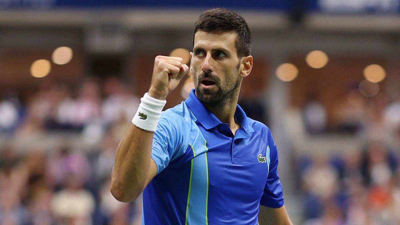 Djokovic celebrates a point against Medvedev.