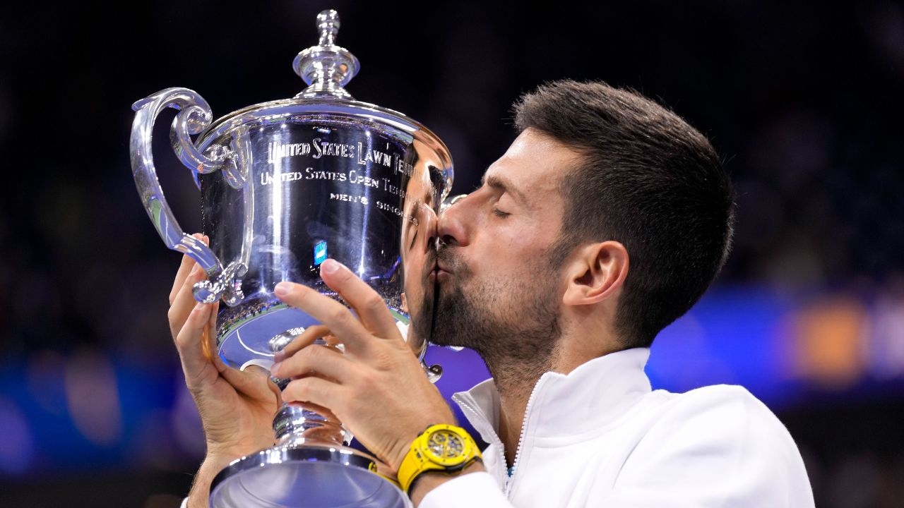 Novak Djokovic, of Serbia, kisses the championship trophy after defeating Daniil Medvedev, of Russia, in the men's singles final of the U.S. Open tennis championships, Sunday, Sept. 10, 2023, in New York. (AP Photo/Manu Fernandez)