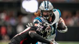 Sep 10, 2023; Atlanta, Georgia, USA; Carolina Panthers tight end Hayden Hurst (81) runs against Atlanta Falcons safety Richie Grant (27) during the first half at Mercedes-Benz Stadium. Mandatory Credit: Dale Zanine-USA TODAY Sports