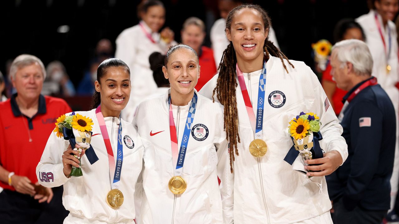 SAITAMA, JAPAN - AUGUST 08: Brittney Griner, Skylar Diggins, and Diana Taurasi of Team United States pose for photographs with their gold medals  during the Women's Basketball medal ceremony on day sixteen of the 2020 Tokyo Olympic games at Saitama Super Arena on August 08, 2021 in Saitama, Japan. (Photo by Kevin C. Cox/Getty Images)