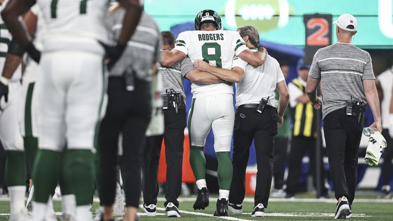 EAST RUTHERFORD, NEW JERSEY - SEPTEMBER 11: Aaron Rodgers #8 of the New York Jets is helped off the field for an apparent injury during a game against the Buffalo Bills at MetLife Stadium on September 11, 2023 in East Rutherford, New Jersey. (Photo by Michael Owens/Getty Images)