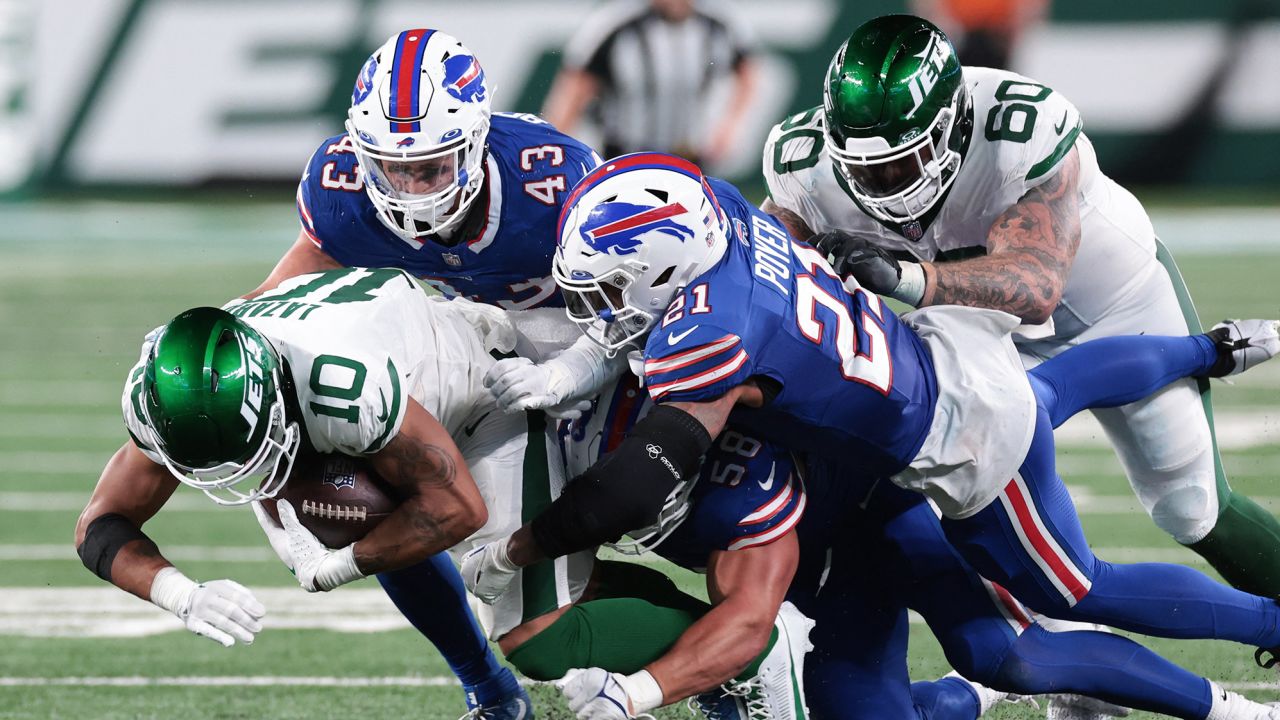 Sep 11, 2023; East Rutherford, New Jersey, USA; New York Jets wide receiver Allen Lazard (10) is tackled by Buffalo Bills safety Jordan Poyer (21) and linebacker Terrel Bernard (43) during the second half at MetLife Stadium. Mandatory Credit: Vincent Carchietta-USA TODAY Sports