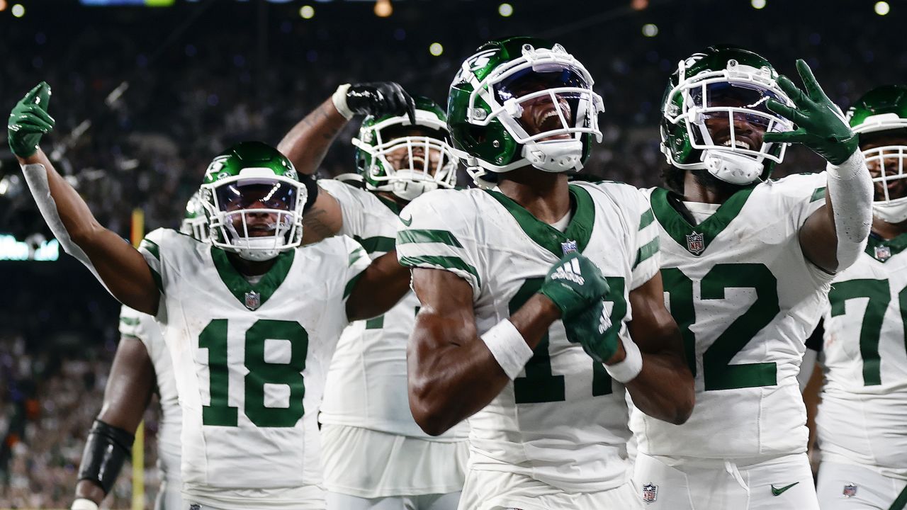 New York Jets wide receiver Garrett Wilson (17) celebrates with teammates after catching a pass for a touchdown against the Buffalo Bills during the fourth quarter of an NFL football game, Monday, Sept. 11, 2023, in East Rutherford, N.J. (AP Photo/Adam Hunger)