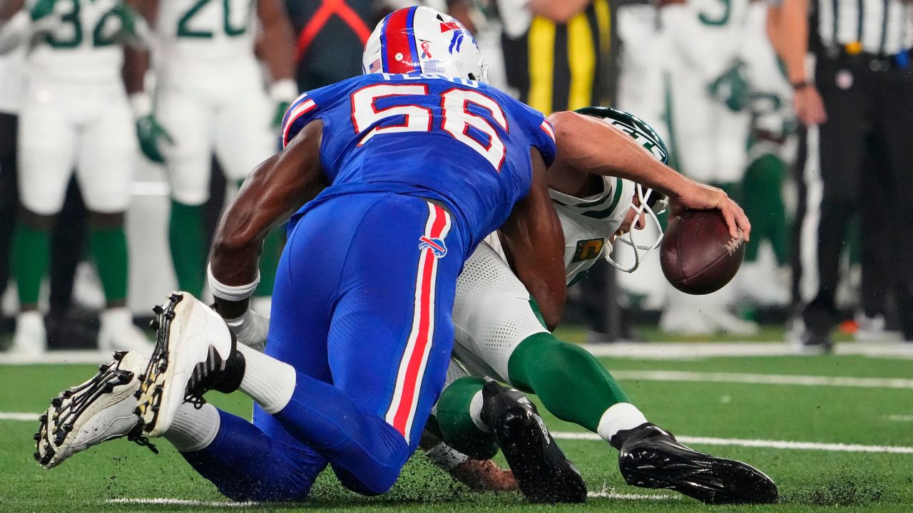 Sep 11, 2023; East Rutherford, New Jersey, USA; Buffalo Bills defensive end Leonard Floyd (56) sacks New York Jets quarterback Aaron Rodgers (8) in the fourth play from scrimmage at MetLife Stadium. Rogers left the game with an injury and did not return. Mandatory Credit: Robert Deutsch-USA TODAY Sports