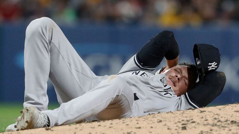 A Yankees pitcher was carted off the field and appeared bloody after being hit with a ball during a Pirates game