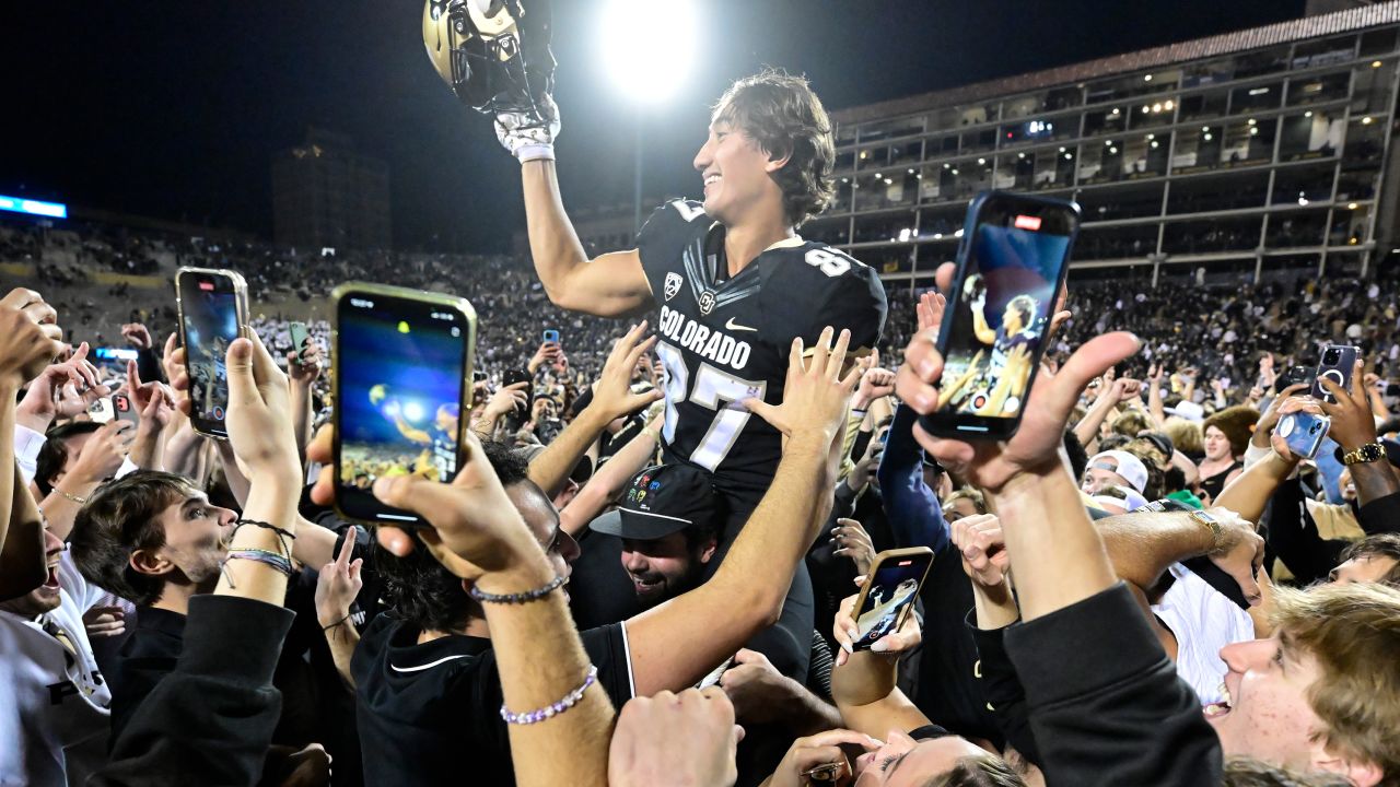 Colorado Buffaloes tight end Michael Harrison (87) celebrates with the fans on the field after winning the Rocky Mountain Showdown against the Colorado State Rams 43-35 in double over time at Folsom Field September 16, 2023.