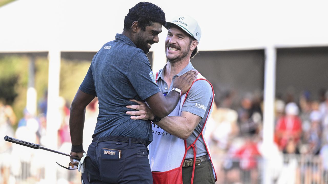 NAPA, CALIFORNIA - SEPTEMBER 17: Sahith Theegala of the United States celebrates his win on the 18th green with caddie Carl Smith during the final round of the Fortinet Championship at Silverado Resort and Spa on September 17, 2023 in Napa, California. (Photo by Orlando Ramirez/Getty Images)