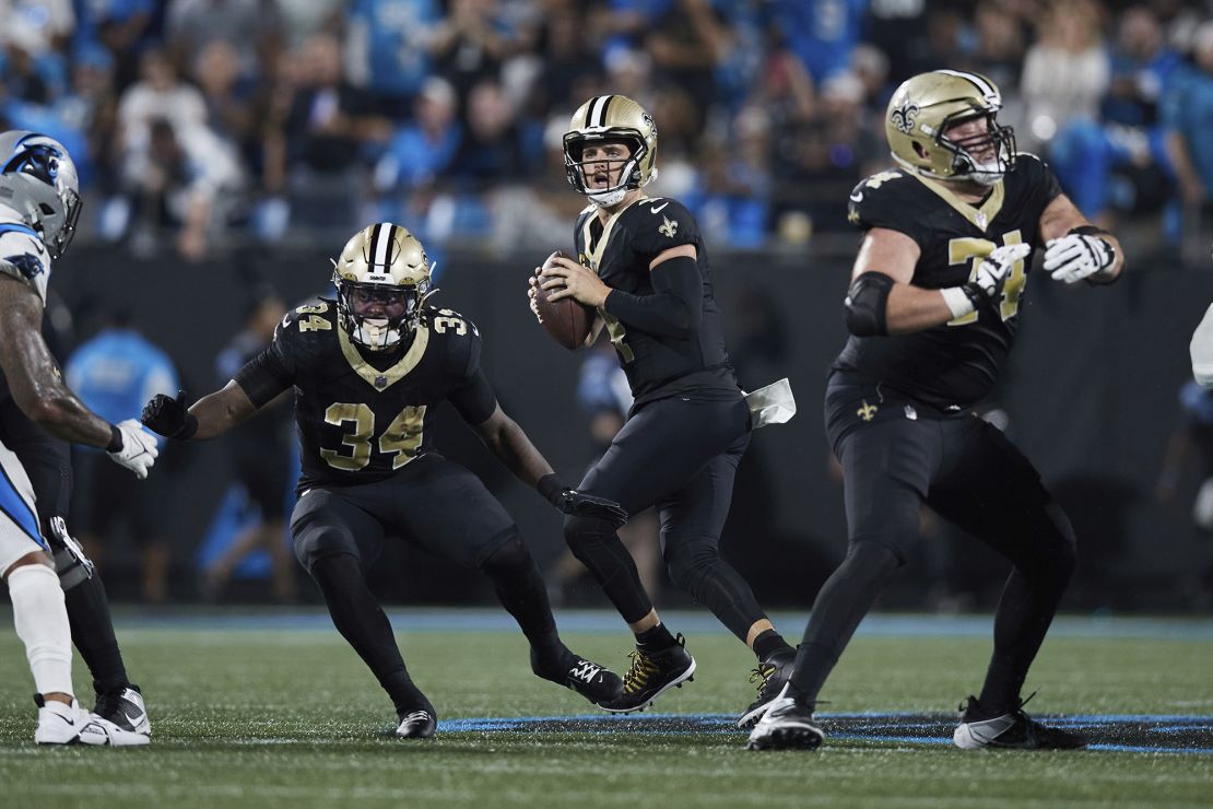 New Orleans Saints quarterback Derek Carr (4) drops back to pass during an NFL football game against the Carolina Panthers, Monday, Sep. 18, 2023, in Charlotte, N.C. (AP Photo/Brian Westerholt)