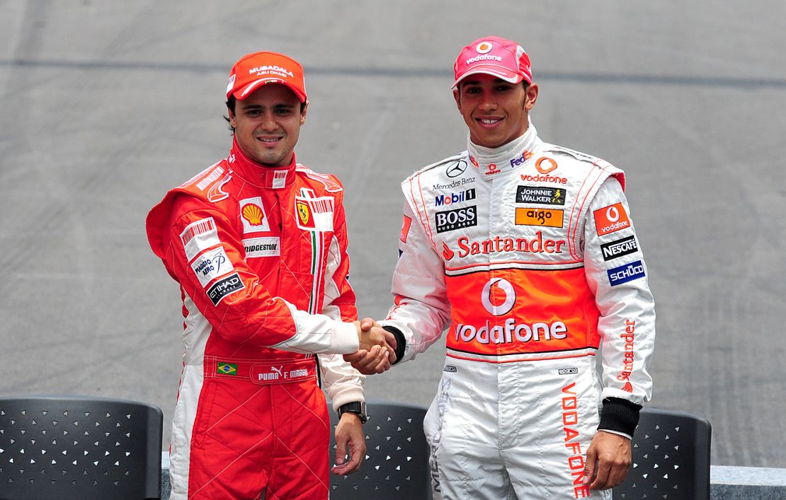 Formula One Championship rivals Felipe Massa (left) and Lewis Hamilton shake hands prior to the Brazilian Grand Prix at Interlagos   (Photo by Rui Vieira - PA Images/PA Images via Getty Images)