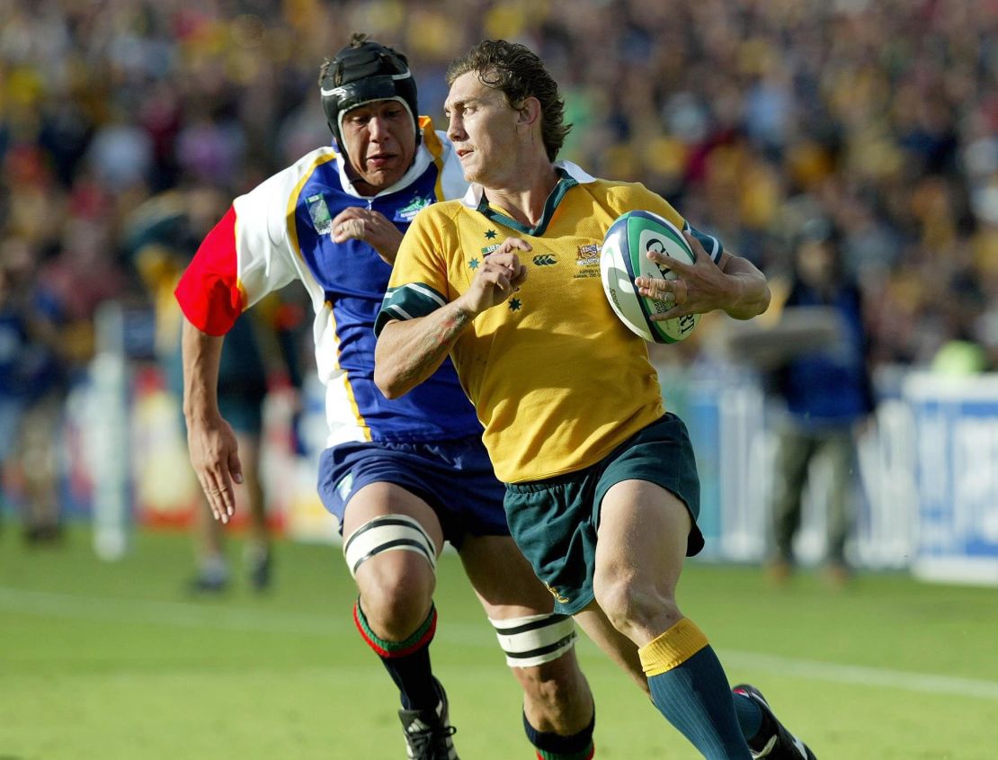 Matt Rogers beats the cover of Namibia's Jurgens van Lill to score Australia's 21st try in thier 142-0 victory in the Rugby World Cup Pool A match at the Oval Stadium, Adelaide. NO MOBILE PHONE USE. INTERNET SITES MAY ONLY USE ONE IMAGE EVERY FIVE MINUTES DURING THE MATCH   (Photo by David Davies - PA Images/PA Images via Getty Images)