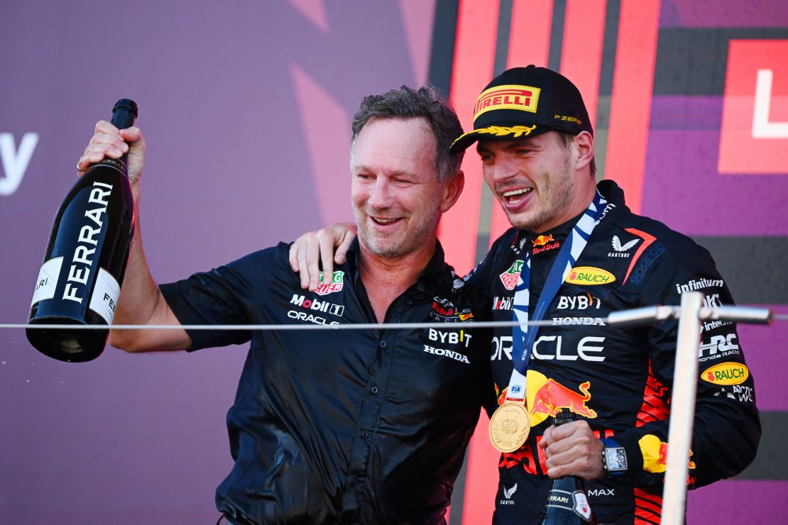 SUZUKA, JAPAN - SEPTEMBER 24: Race winner Max Verstappen of the Netherlands and Oracle Red Bull Racing and Red Bull Racing Team Principal Christian Horner celebrate on the podium during the F1 Grand Prix of Japan at Suzuka International Racing Course on September 24, 2023 in Suzuka, Japan. (Photo by Clive Mason/Getty Images)