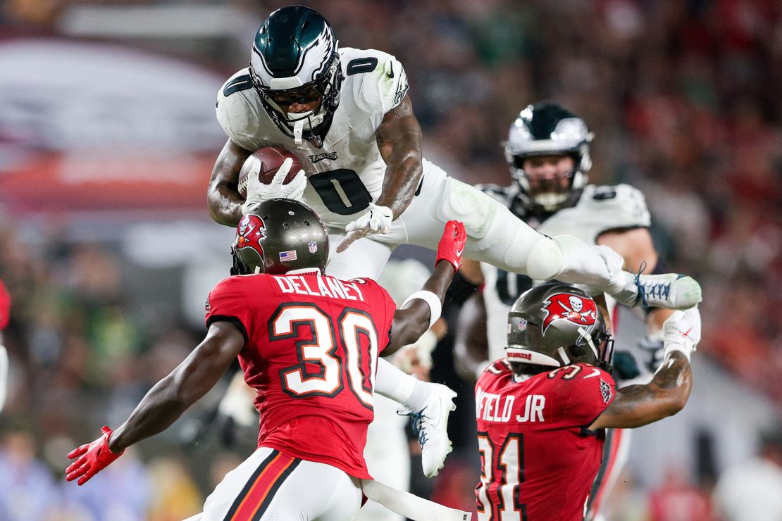 Sep 25, 2023; Tampa, Florida, USA;  Philadelphia Eagles running back D'Andre Swift (0) leaps over Tampa Bay Buccaneers safety Antoine Winfield Jr. (31) and cornerback Dee Delaney (30) in the third quarter at Raymond James Stadium. Mandatory Credit: Nathan Ray Seebeck-USA TODAY Sports