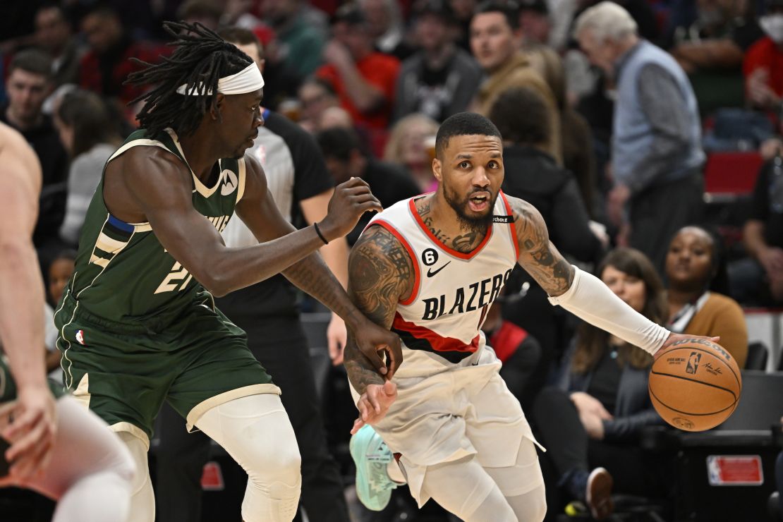 PORTLAND, OREGON - FEBRUARY 06: Damian Lillard #0 of the Portland Trail Blazers dribbles against Jrue Holiday #21 of the Milwaukee Bucks during the third quarter at the Moda Center on February 06, 2023 in Portland, Oregon. The Milwaukee Bucks won 127-108. NOTE TO USER: User expressly acknowledges and agrees that, by downloading and or using this photograph, User is consenting to the terms and conditions of the Getty Images License Agreement. (Photo by Alika Jenner/Getty Images)