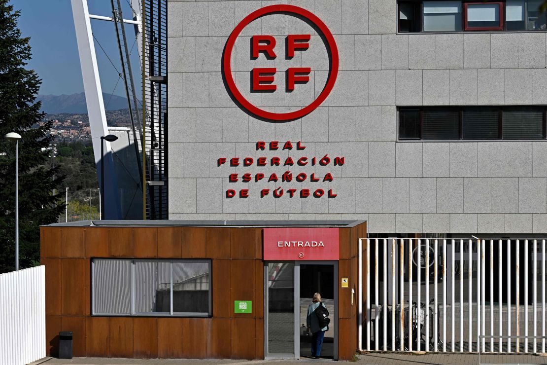 A person accesses the Spanish football federation headquarters where a judge on September 28, 2023 has ordered a police search at the headquarters of the Spanish refereeing committee, in Las Rozas de Madrid. A Spanish judge today ordered a search of the headquarters of the country's football refereeing committee as part of a probe into payments made by FC Barcelona to a firm owned by a high-ranking official of the body. Spanish prosecutors suspect the club paid millions of euros to the company of Jose Mara Enriquez Negreira, the former vice-president of Spanish football's refereeing committee, between 2001 and 2018, to try to influence referee decisions. (Photo by JAVIER SORIANO / AFP) (Photo by JAVIER SORIANO/AFP via Getty Images)