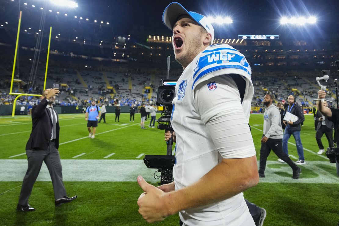 GREEN BAY, WI - SEPTEMBER 28: Jared Goff #16 of the Detroit Lions celebrates with fans after an NFL football game at Lambeau Field on September 28, 2023 in Green Bay, Wisconsin. (Photo by Cooper Neill/Getty Images)