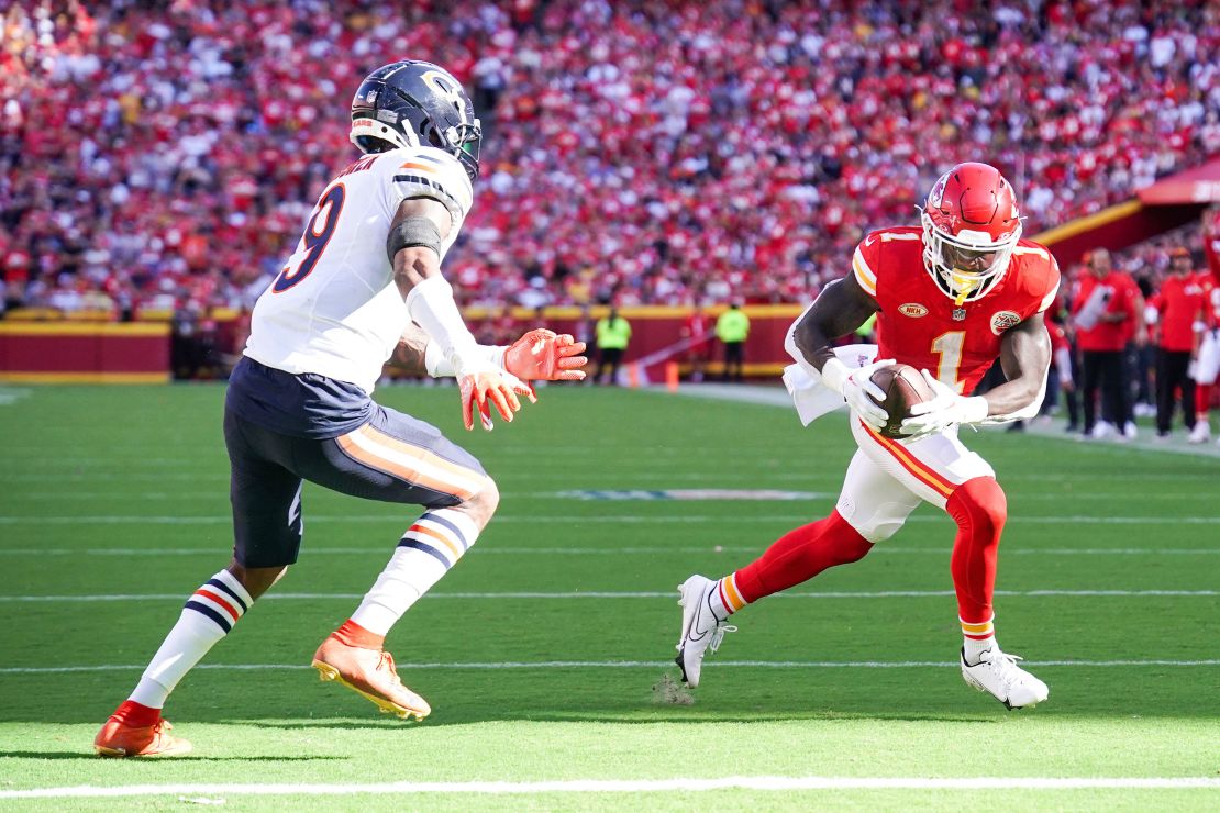 Sep 24, 2023; Kansas City, Missouri, USA; Kansas City Chiefs running back Jerick McKinnon (1) scores a touchdown as Chicago Bears safety Jaquan Brisker (9) defends during the first half at GEHA Field at Arrowhead Stadium. Mandatory Credit: Denny Medley-USA TODAY Sports