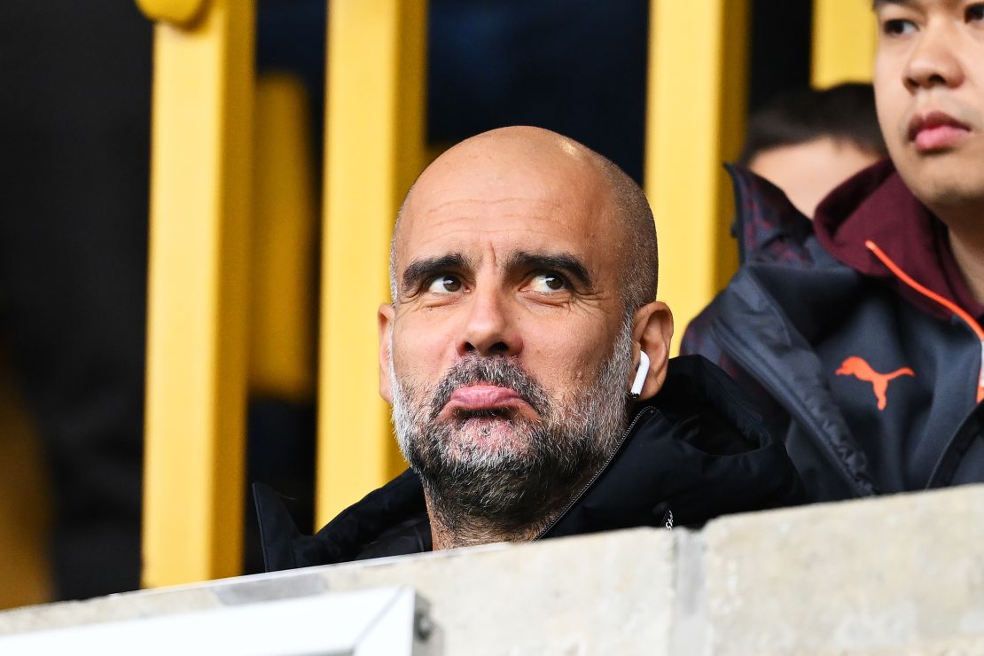 WOLVERHAMPTON, ENGLAND - SEPTEMBER 30: Pep Guardiola, Manager of Manchester City, reacts from the stands, serving a touchline ban suspension during the Premier League match between Wolverhampton Wanderers and Manchester City at Molineux on September 30, 2023 in Wolverhampton, England. (Photo by Michael Regan/Getty Images)