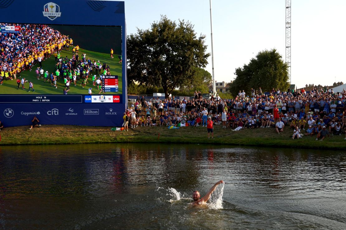 ROME, ITALY - OCTOBER 01: A spectator swims in the water by the 18th green during the Sunday singles matches of the 2023 Ryder Cup at Marco Simone Golf Club on October 01, 2023 in Rome, Italy. (Photo by Maddie Meyer/PGA of America/PGA of America via Getty Images)