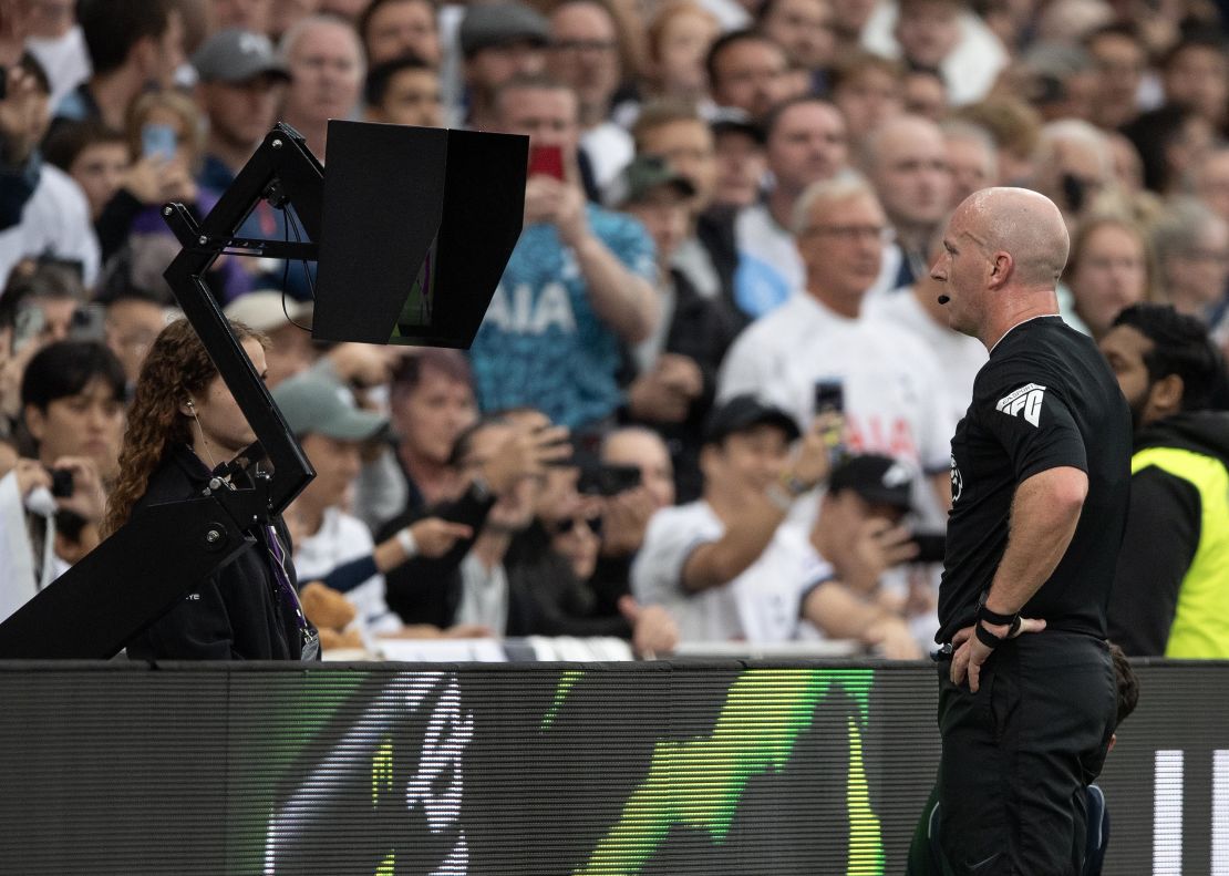 LONDON, ENGLAND - SEPTEMBER 30: Referee Simon Hooper views the VAR monitor before sending off Curtis Jones of Livrpool during the Premier League match between Tottenham Hotspur and Liverpool FC at Tottenham Hotspur Stadium on September 30, 2023 in London, England. (Photo by Visionhaus/Getty Images)