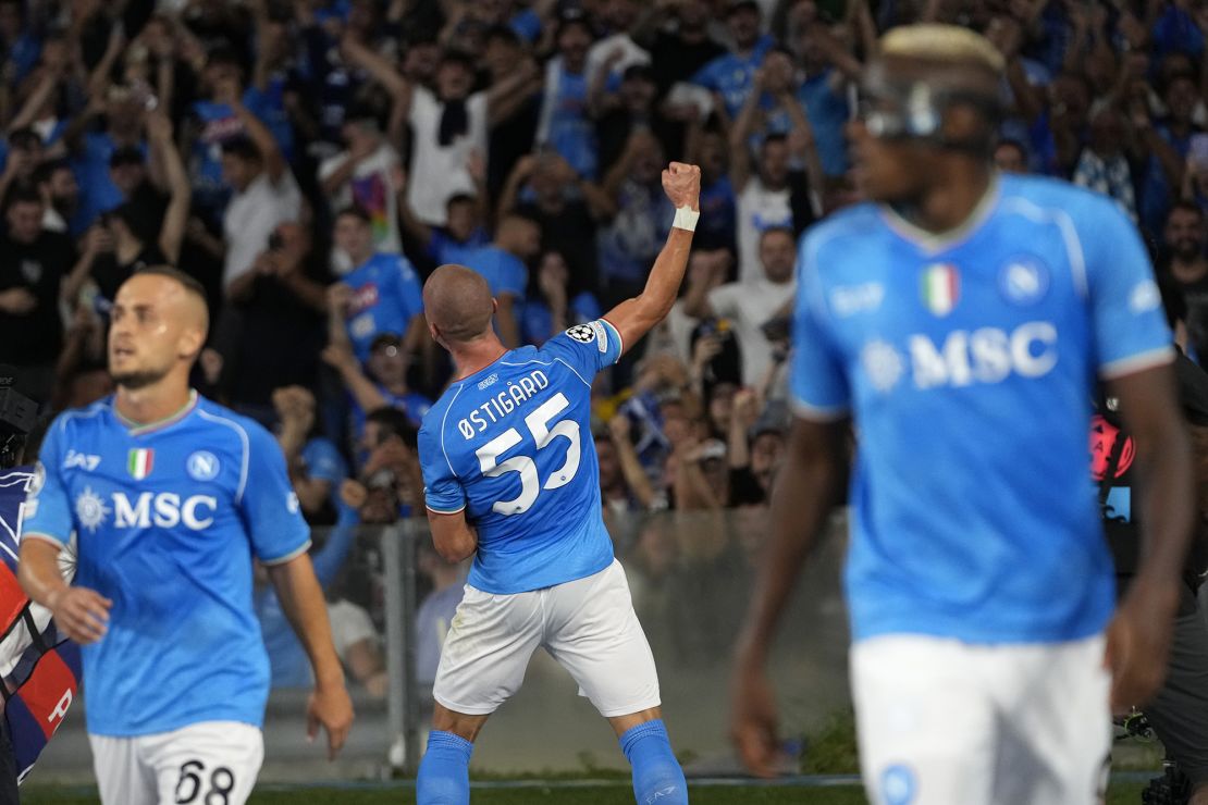 Napoli's Leo Ostigard celebrates after scoring his sides first goal during the Champions League group C soccer match between Napoli and Real Madrid at the Diego Armando Maradona stadium in Naples, Italy, Tuesday, Oct. 3, 2023. (AP Photo/Alessandra Tarantino)