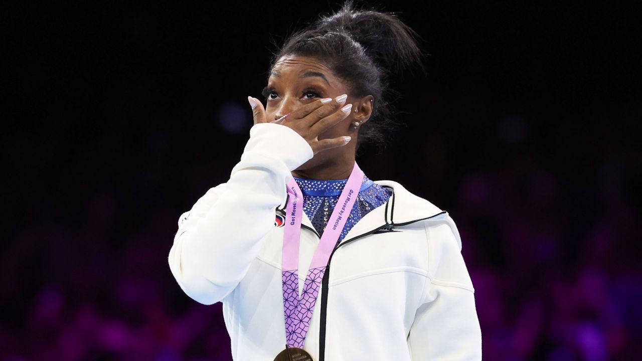 United States' Simone Biles cries on the podium after wining the gold medal during the women's all-round final at the Artistic Gymnastics World Championships in Antwerp, Belgium, Friday, Oct. 6, 2023. (AP Photo/Geert vanden Wijngaert)