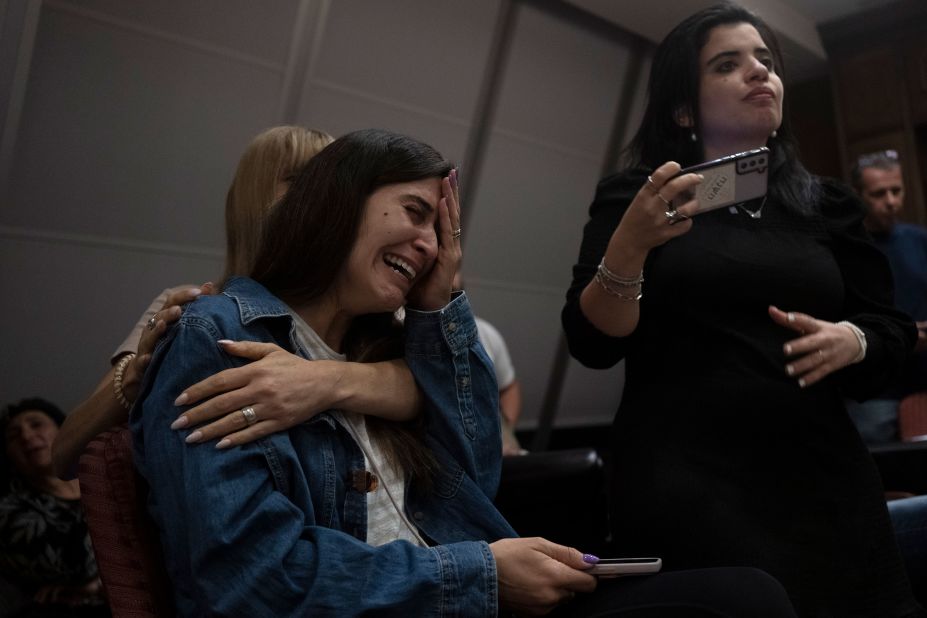 A relative of an Israeli missing since the attacks is overcome by emotion during a press conference in Ramat Gan, Israel, on October 8.