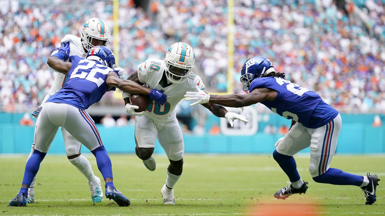 MIAMI GARDENS, FLORIDA - OCTOBER 08: Tyreek Hill #10 of the Miami Dolphins runs the ball against the New York Giants during the first quarter at Hard Rock Stadium on October 08, 2023 in Miami Gardens, Florida. (Photo by Rich Storry/Getty Images)