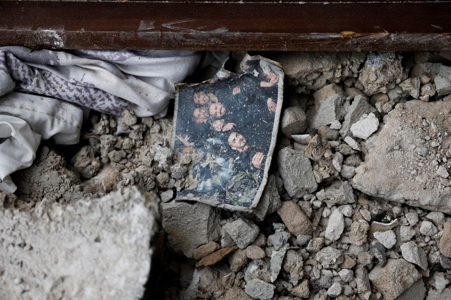 A photo from a wedding is seen on the ground of a building in Ashkelon that was hit by rockets from Gaza on October 9.