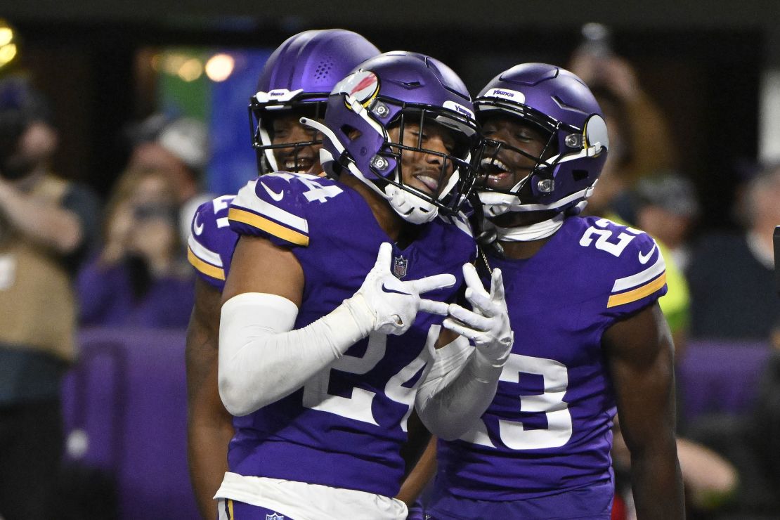 MINNEAPOLIS, MINNESOTA - OCTOBER 23: Camryn Bynum #24 of the Minnesota Vikings celebrates his game ending interception against the San Francisco 49ers with Andrew Booth Jr. #23 at U.S. Bank Stadium on October 23, 2023 in Minneapolis, Minnesota. (Photo by Stephen Maturen/Getty Images)