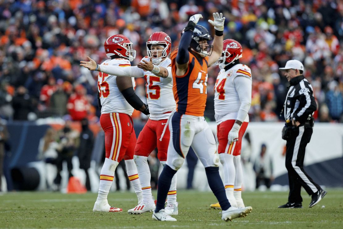 Oct 29, 2023; Denver, Colorado, USA; Kansas City Chiefs quarterback Patrick Mahomes (15) reacts as Denver Broncos linebacker Alex Singleton (49) gestures in the fourth quarter at Empower Field at Mile High. Mandatory Credit: Isaiah J. Downing-USA TODAY Sports