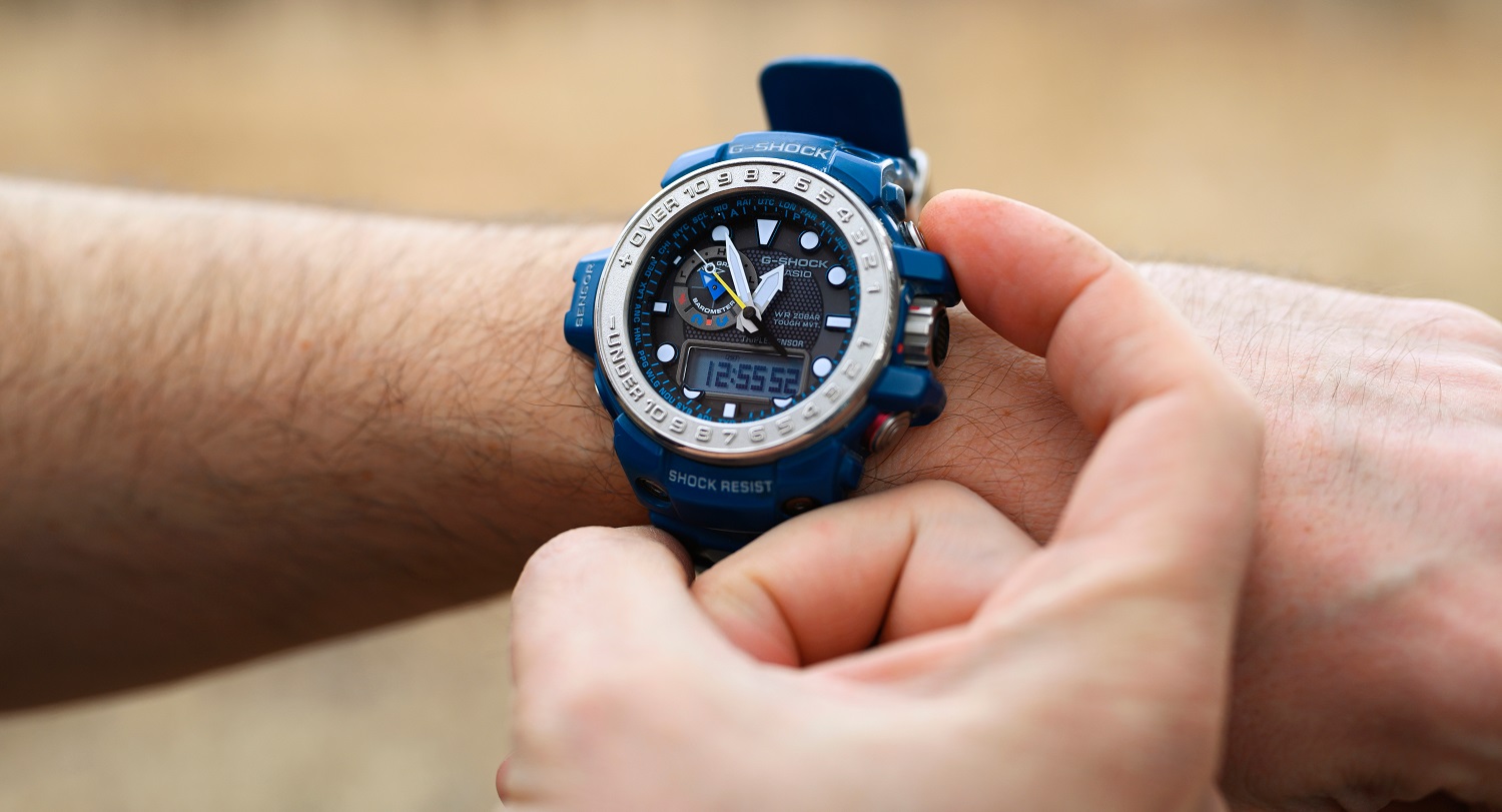 A Casio G-Shock GWN watch on a man’s wrist.