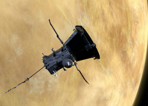 An illustration of the Parker Solar Probe in front of Venus.