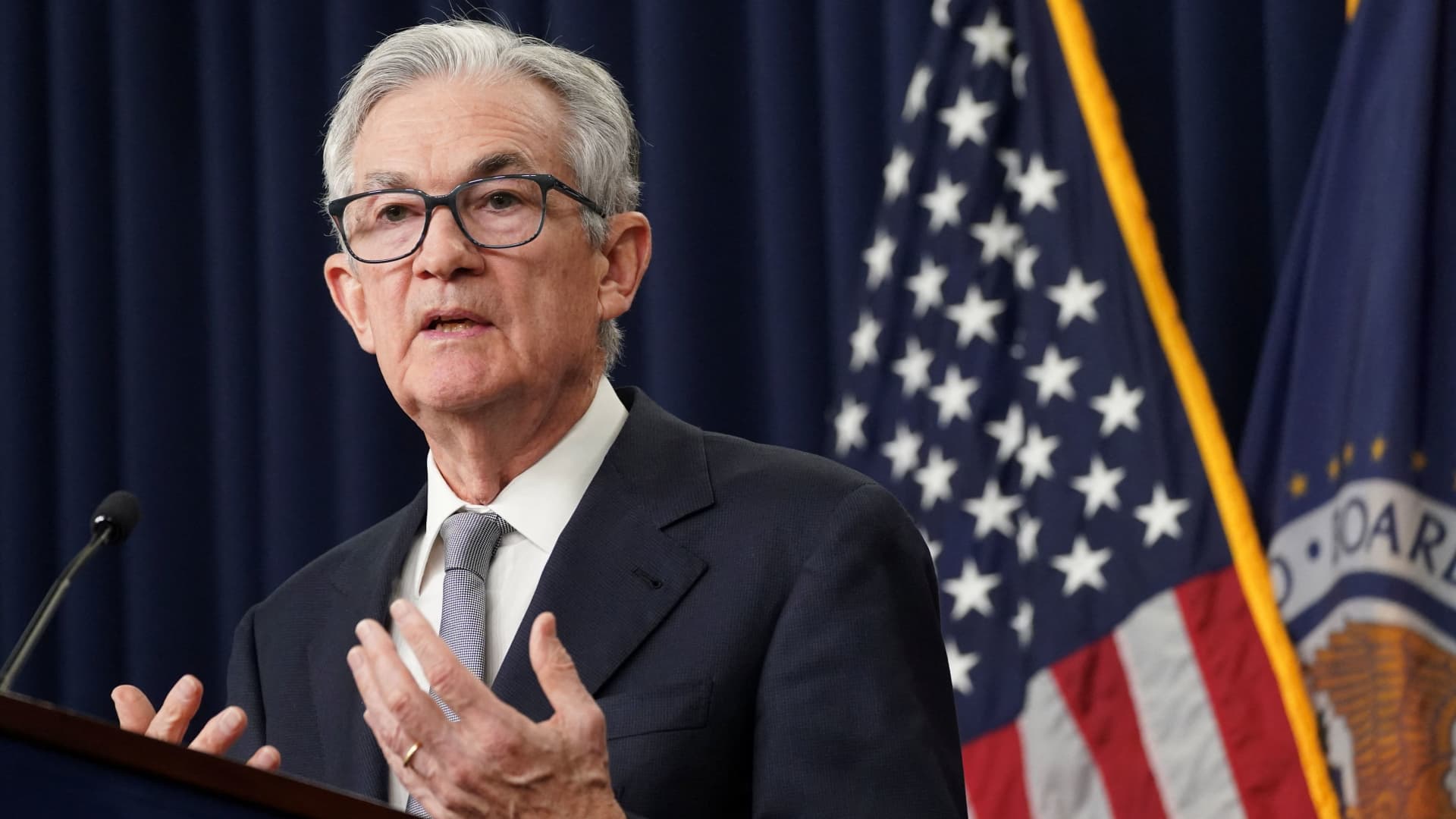 Fed holds rates steady, upgrades assessment of economic growth