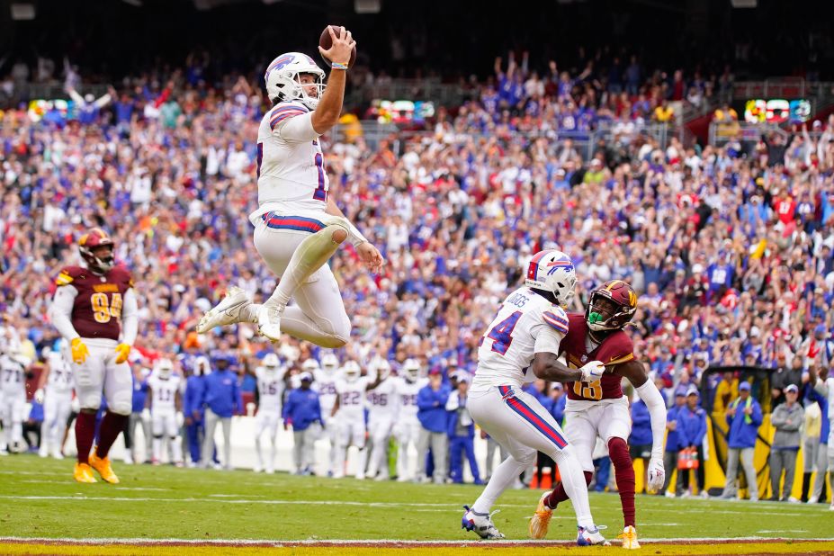 Buffalo Bills quarterback Josh Allen leaps into the endzone for a touchdown during his team's 37-3 win over the Washington Commanders.