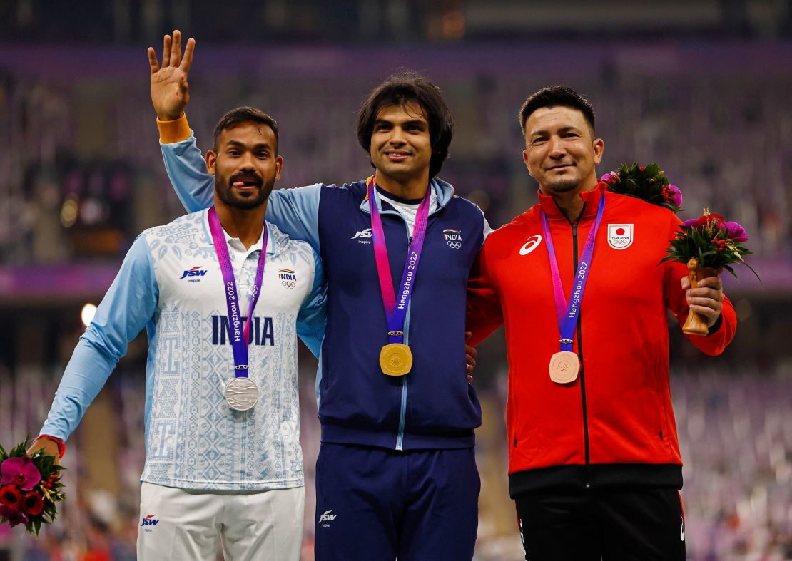 Asian Games - Hangzhou 2022 - Athletics - Olympic Sports Centre, Hangzhou, China - October 4, 2023
Gold medallist India's Neeraj Chopra stands with Silver medallist India's Kishore Kumar Jena and Bronze medallist Japan's Roderick Genki Dean during the medal ceremony for Men's Javelin Throw REUTERS/Tingshu Wang