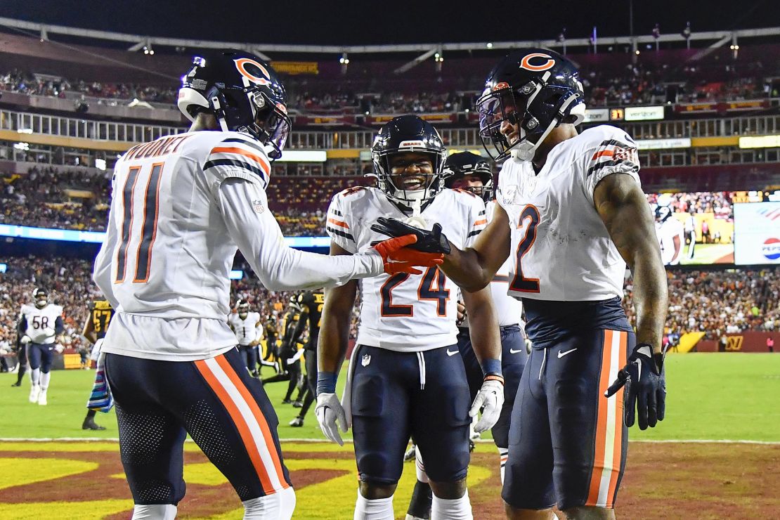 Oct 5, 2023; Landover, Maryland, USA; Chicago Bears wide receiver DJ Moore (2) celebrates with wide receiver Darnell Mooney (11) after scoring a touchdown against the Washington Commanders during the first half at FedExField. Mandatory Credit: Brad Mills-USA TODAY Sports