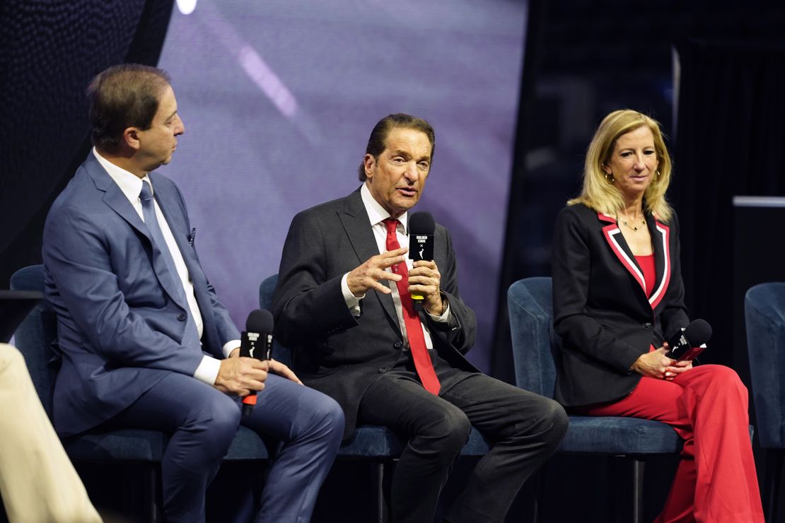 Golden State Warriors Co-Executive Chairman Peter Guber, center, answers questions after an WNBA expansion franchise for the San Francisco Bay Area was announced at Chase Center in San Francisco, Thursday, Oct. 5, 2023. The team will begin play in the 2025 season. At left is Warriors CEO Joe Lacob and at right is WNBA Commissioner Cathy Engelbert. (AP Photo/Eric Risberg)