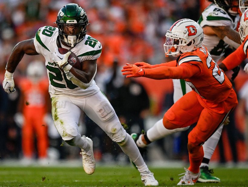 New York Jets running back Breece Hall carries the ball during a game against the Denver Broncos. The Jets won 31-21.