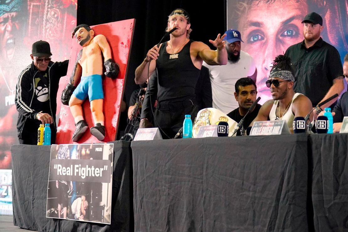 Logan Paul with a cake during a press conference at the OVO Arena Wembley, London. Picture date: Tuesday August 22, 2023. 73418372 (Press Association via AP Images)