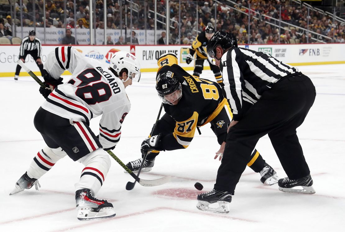 Oct 10, 2023; Pittsburgh, Pennsylvania, USA; Chicago Blackhawks center Connor Bedard (98) and Pittsburgh Penguins center Sidney Crosby (87) take a face-off during the third period at the PPG Paints Arena. Chicago won 4-2.  Mandatory Credit: Charles LeClaire-USA TODAY Sports