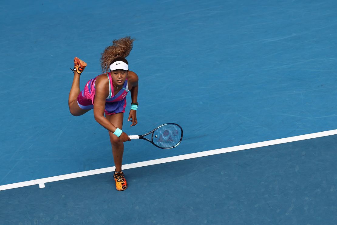 MELBOURNE, AUSTRALIA - JANUARY 17: Naomi Osaka of Japan serves in her first round singles match against Camila Osorio of Colombia during day one of the 2022 Australian Open at Melbourne Park on January 17, 2022 in Melbourne, Australia. (Photo by Cameron Spencer/Getty Images)