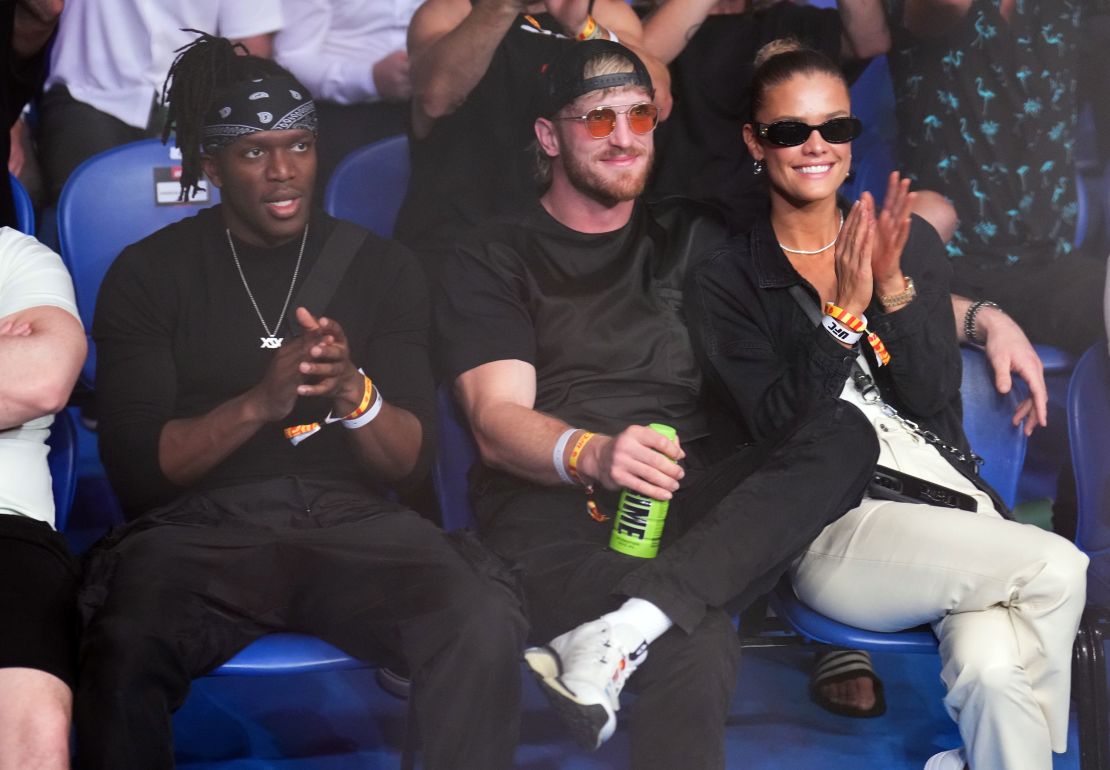 PERTH, AUSTRALIA - FEBRUARY 12: (L-R) KSI, Logan Paul, and Nina Agdal are seen in attendance during the UFC 284 event at RAC Arena on February 12, 2023 in Perth, Australia. (Photo by Chris Unger/Zuffa LLC via Getty Images)