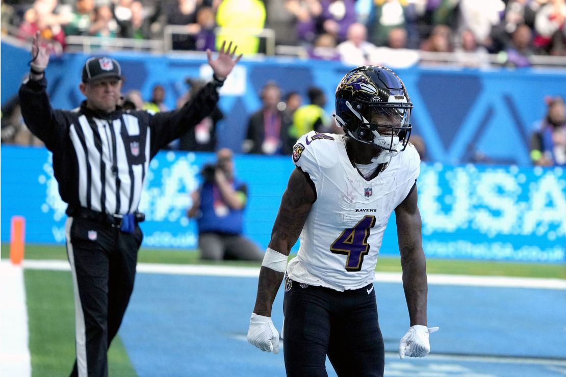 Baltimore Ravens wide receiver Zay Flowers (4) celebrates after scoring on a 10-yard touchdown reception against the Tennessee Titans in the first half during an NFL International Series game at Tottenham Hotspur Stadium.